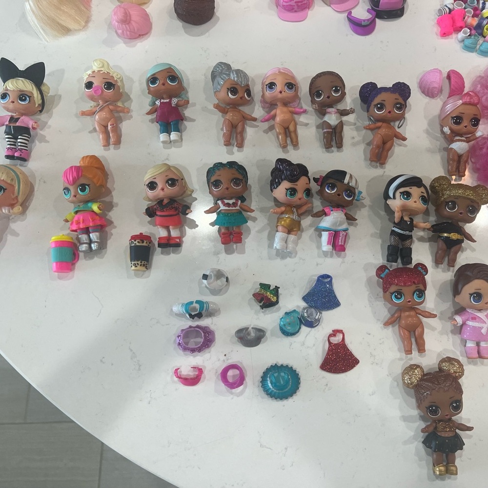 (19) L.O.L. Surprise! Dolls with accessories and carrying case